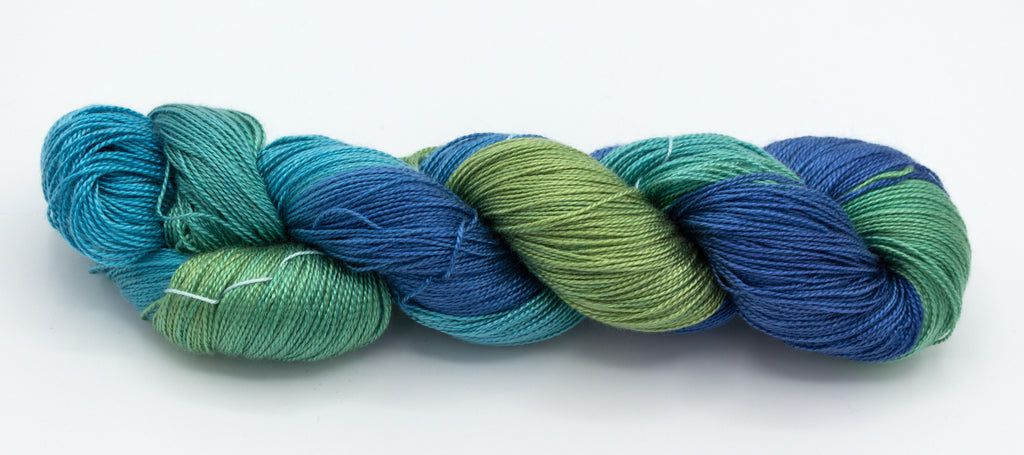 Peacock Variegated Hand-Painted Tencel™ 4 oz yarn skein by Shiny Dime Fibers